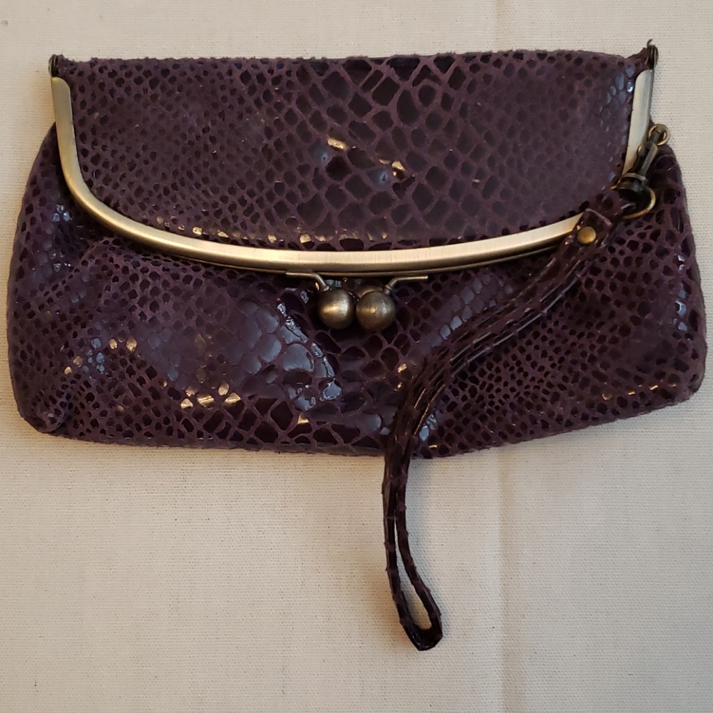 Wristlet purple leather snake print.